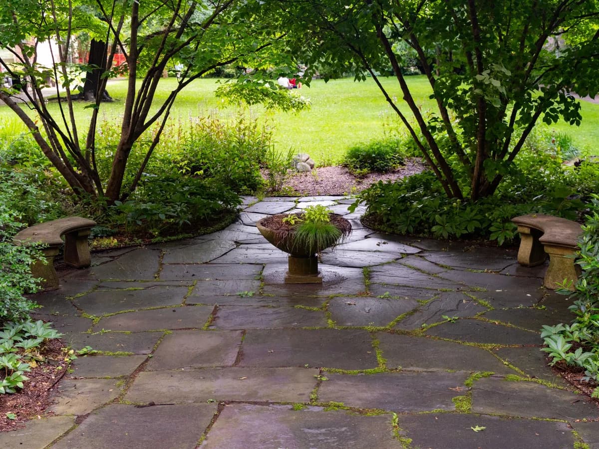 Patios — Outdoor living spaces designed for gathering, in pavers, stone, or concrete.
