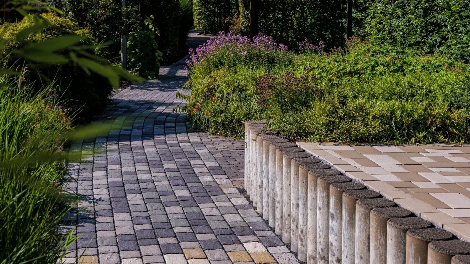 Natural stone walkway winding through a garden